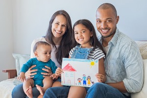 Happy family sitting on couch